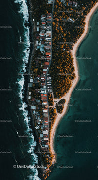 Colorful Coastal Village with Beach and Ocean Aerial View