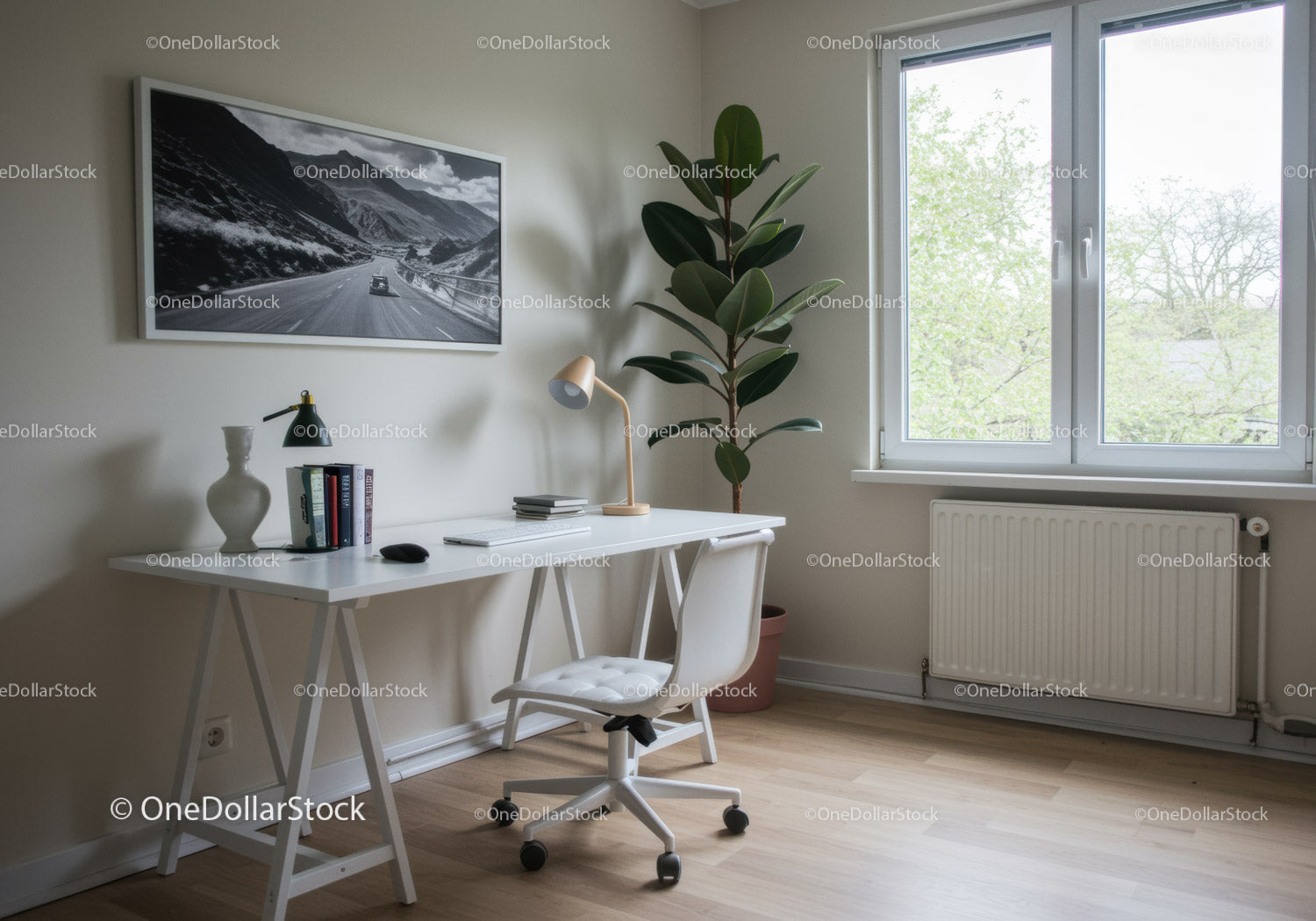 Bright Minimalist Home Office with Potted Plant and Mountain Artwork