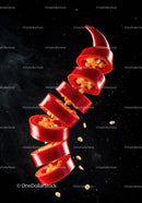 Fresh red chili pepper slices floating with seeds