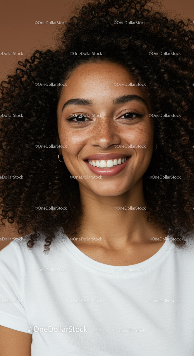 Portrait of a Smiling Woman with Curly Hair and Freckles
