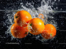 Juicy Oranges Splashing into Water with Fresh and Vibrant Colors