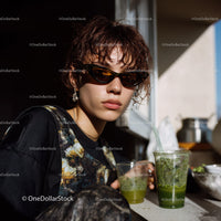 Stylish Young Woman Wearing Sunglasses Enjoying Green Smoothies Outdoors