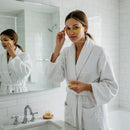 Young Woman Wearing Gold Eye Patches During Skincare Routine