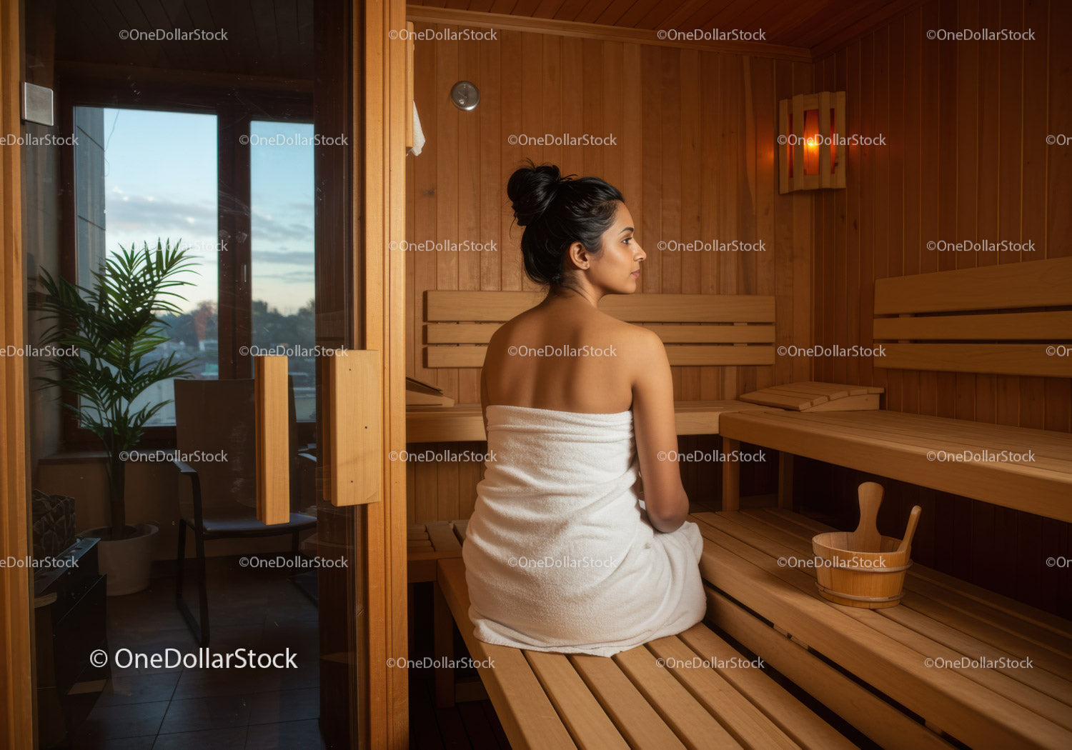 Relaxing Woman Sitting in Sauna Spa Room with Wooden Interior