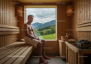 Man Relaxing in Wooden Sauna with Scenic Mountain View
