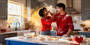 Couple Playfully Baking Heart-Shaped Cookies Together
