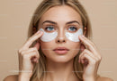Young Woman Applying Under-Eye Patches for Skincare Routine