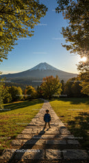 Child Exploring Mountain Trail with Snow-Capped Peak in Bright Autumn Scene
