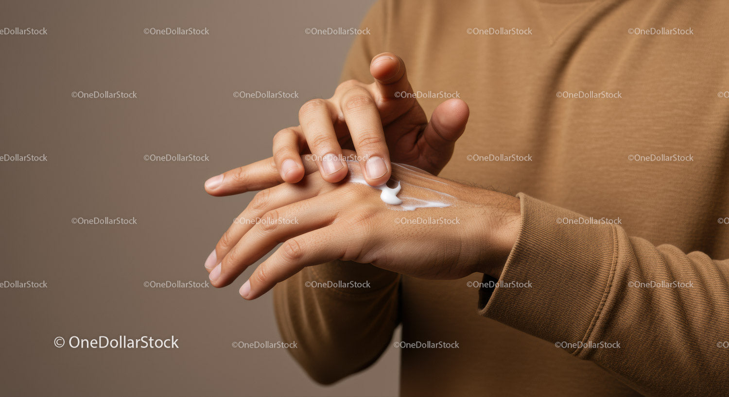 Man Applying Hand Lotion for Skincare and Moisturization