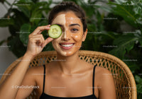 Young Woman with Facial Mask and Green Leaves Background