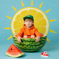 Young boy sitting inside watermelon with lemon sun background