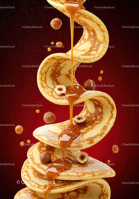 Swirling stack of pancakes drizzled with caramel sauce