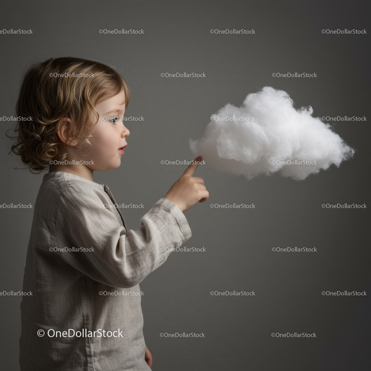 Curious toddler touching fluffy white cloud illusion