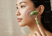 Close-up of an Asian Woman Using Jade Roller for Skin Care