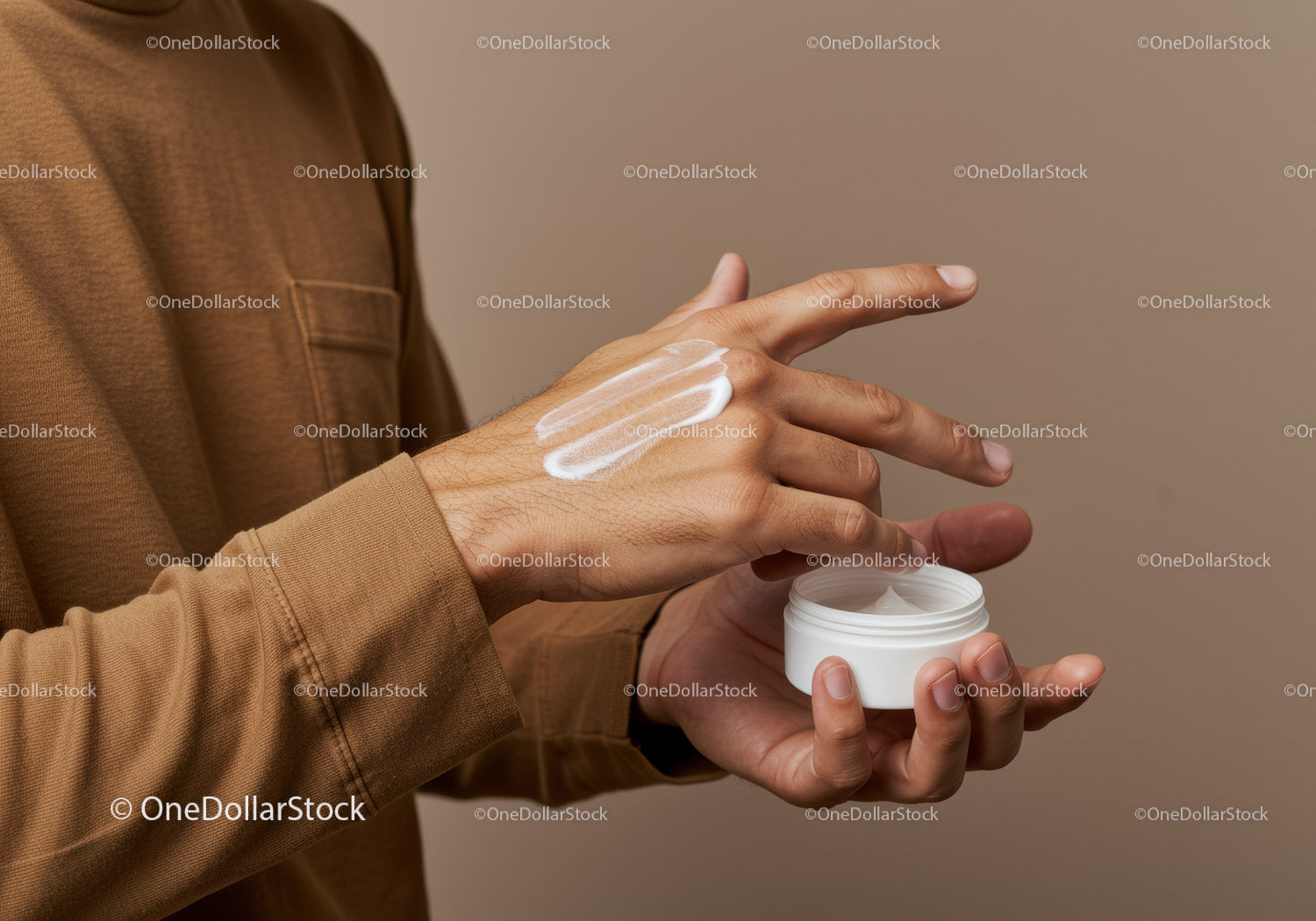 Man Applying Hand Moisturizer in Personal Care Routine