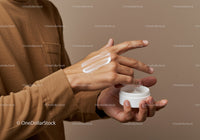 Man Applying Hand Moisturizer in Personal Care Routine