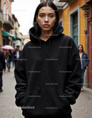 Fashionable Woman Wearing Black Hoodie in Urban City Street