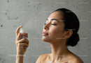 Woman Spraying Facial Mist for Hydration and Skin Refreshment