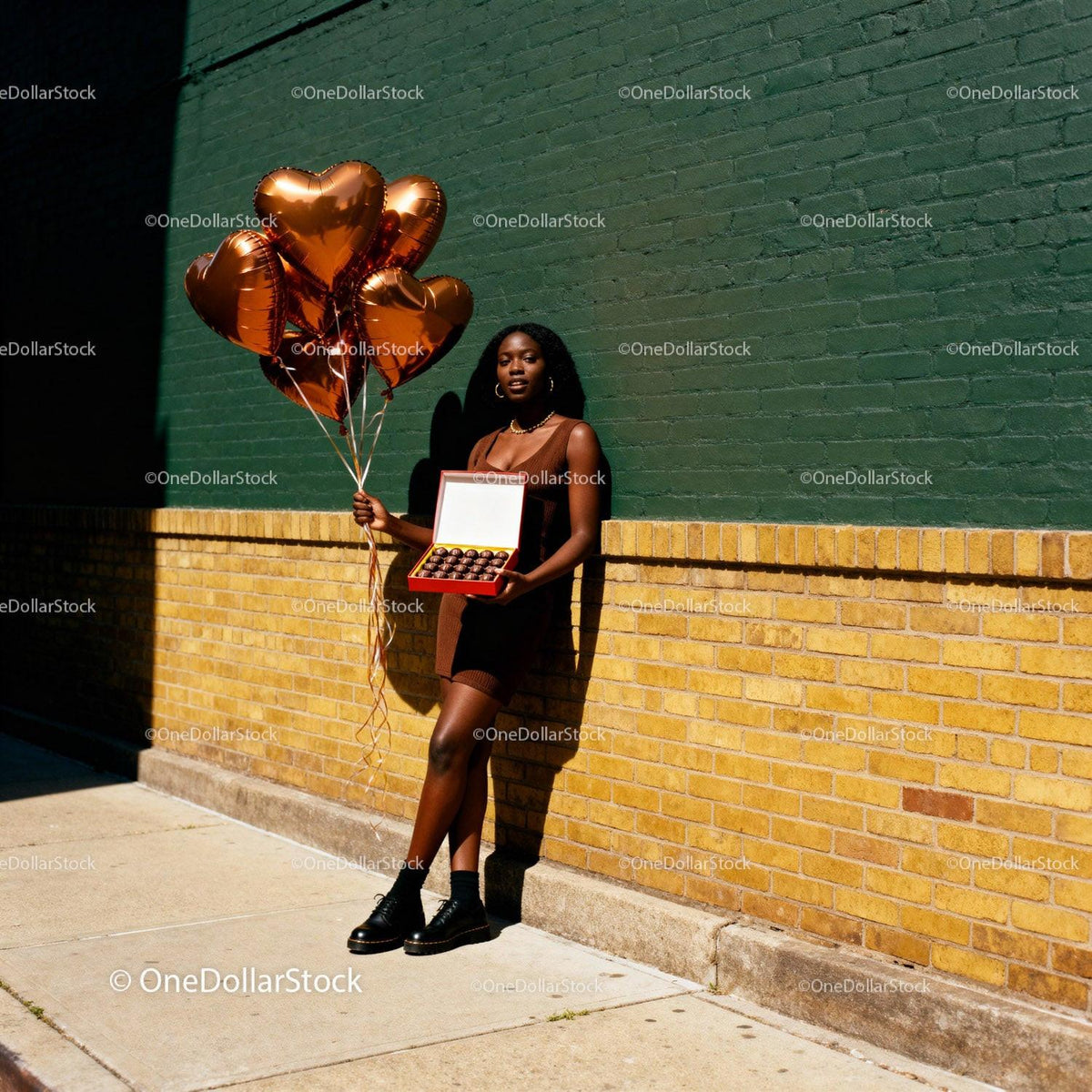 Woman Holding Heart Balloons and Chocolates Outdoors
