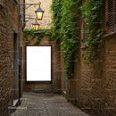 Narrow cobblestone alley with green ivy and glowing lamps