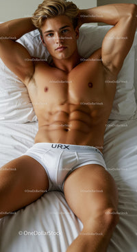 Athletic Young Man Relaxing on Bed in White Underwear