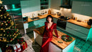 Elegant Woman in Red Dress by Festive Kitchen Island