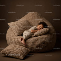 Sleeping toddler resting on cozy textured bean bag