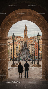 City Street with Tower and Crowds in a European Historic Town