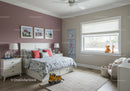 Bright Kids Bedroom With Floral Bedding and Plush Toys