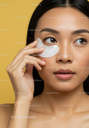 Young Woman Applying Eye Mask for Skincare and Beauty Routine