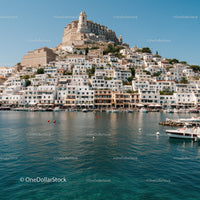 Picturesque Mediterranean Coastline with White Buildings and Yacht Marina