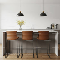 Modern Kitchen with Brown Leather Bar Stools and Black Pendant Lights