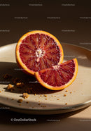 Freshly sliced blood orange on a beige plate