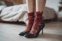 Chic Black Heels and a Red Lace Dress in a Cozy Bedroom Setting