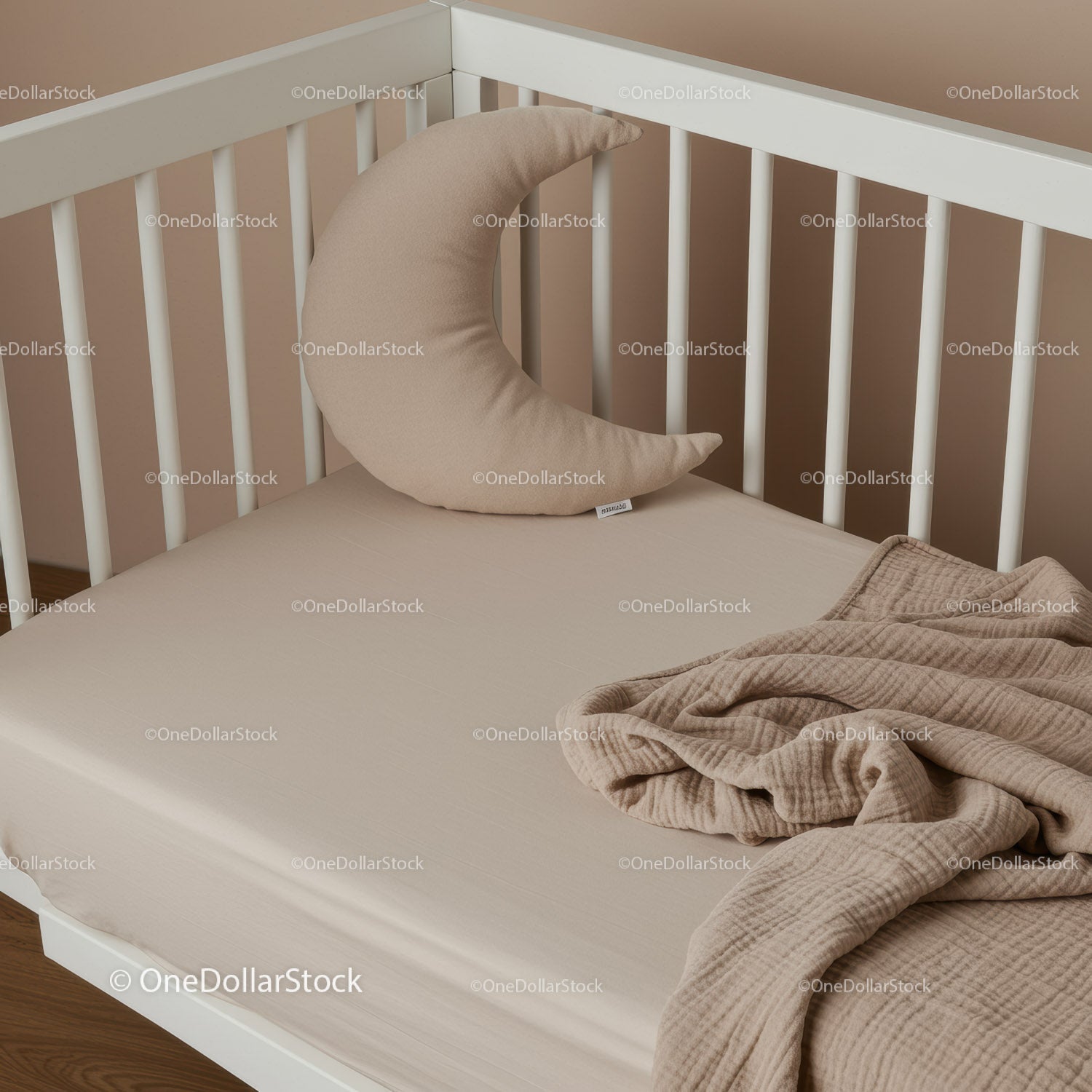 Cozy baby crib with crescent moon pillow and soft blanket