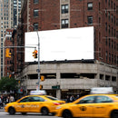 Busy urban street corner with yellow taxis and blank billboard JPG Mockup Image preview