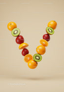 Fresh citrus and berries forming a vibrant flying V shape