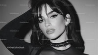 Stylish Young Woman with Elegant Makeup in Black and White Portrait