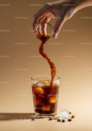 Pouring Cold Brew Coffee Over Ice Cubes in Glass