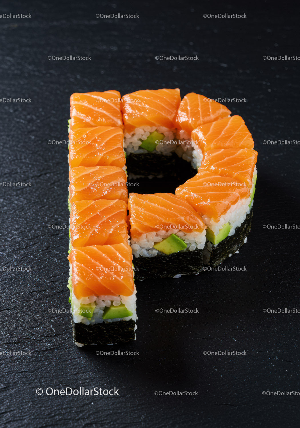 Sushi shaped as letter P with fresh salmon slices