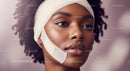Beautiful African Woman with Curly Hair and Natural Makeup Portrait