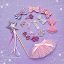Glitter pink hair accessories and tutu on purple background