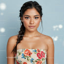 Elegant Young Woman with Floral Top and Braided Hair in Studio