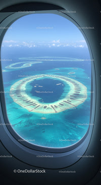 Aerial View of a Tropical Atoll with Clear Blue Water Over an Ocean