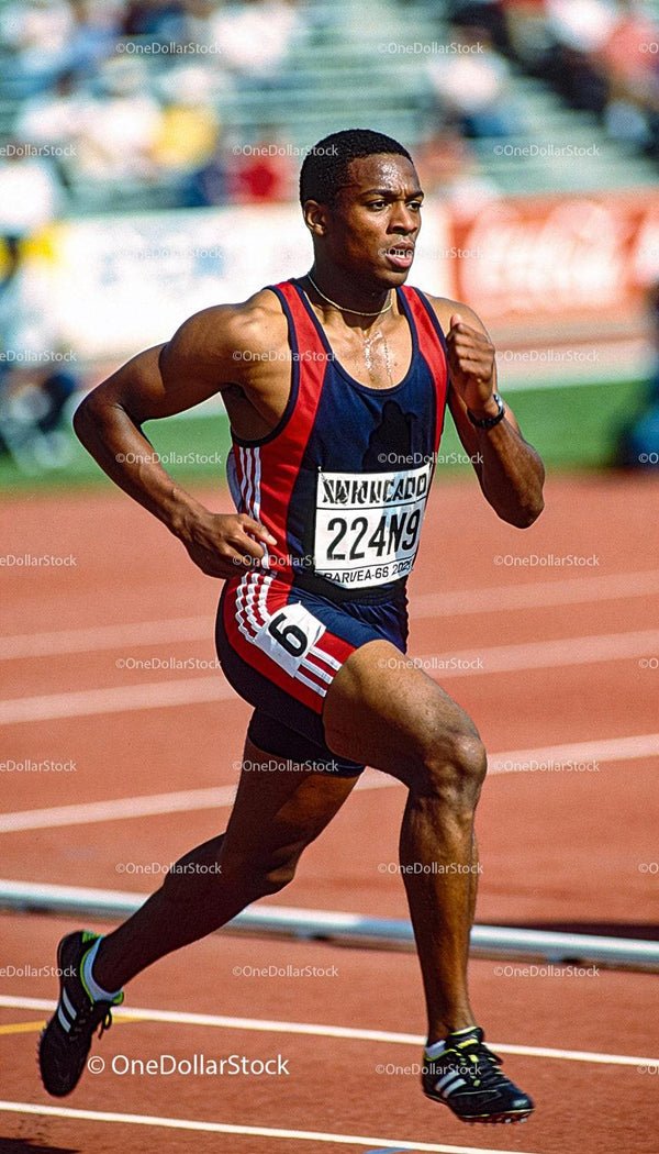 Focused Male Sprinter Racing on Outdoor Track