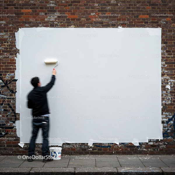 Man Painting Over Graffiti on Urban Brick Wall JPG Mockup Image