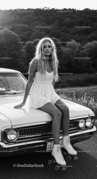 Blonde woman in white dress on classic car with roller skates