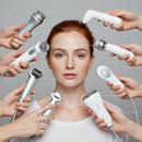 Young woman receiving skincare treatment with multiple beauty devices