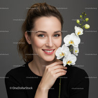 Beautiful Woman Holding White Orchid Flower in Studio Portrait