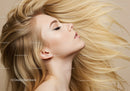 Blonde woman with flowing hair and elegant profile